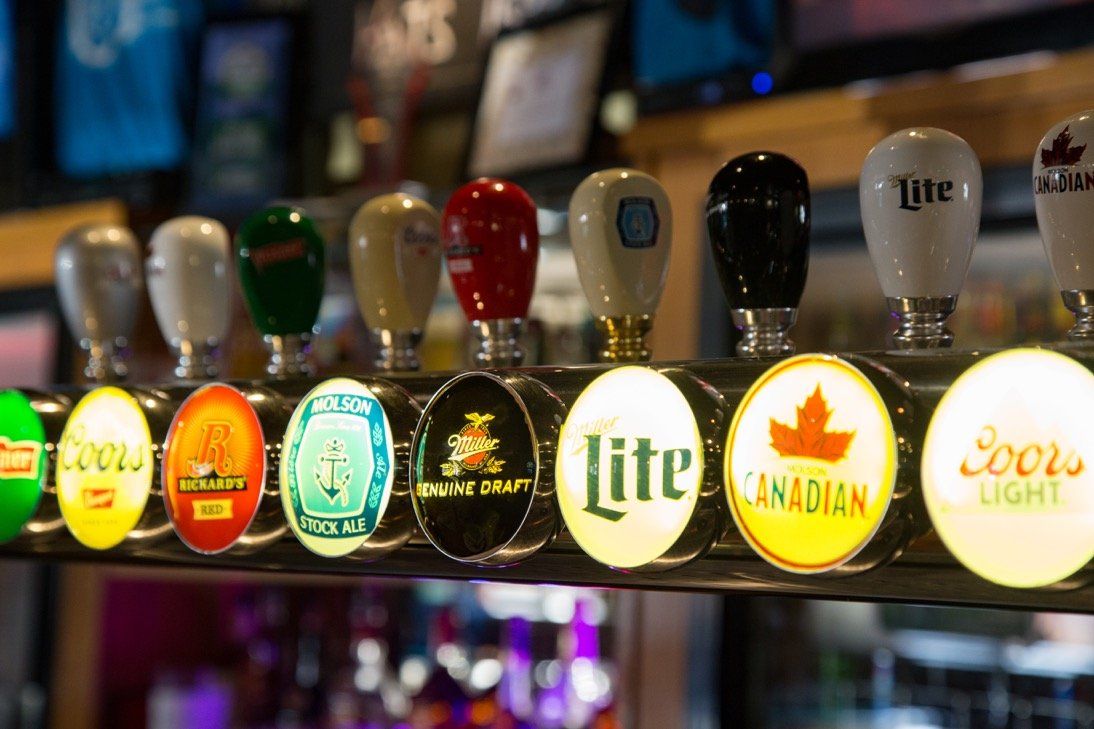 A row of beer taps behind the bar